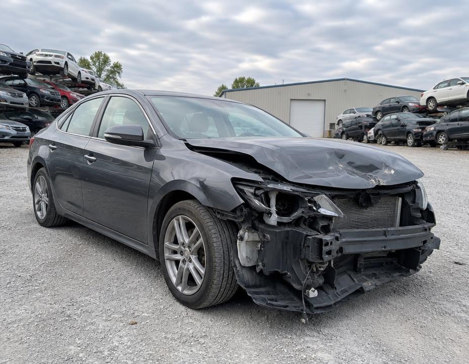 Damaged car in an auto recycling setting